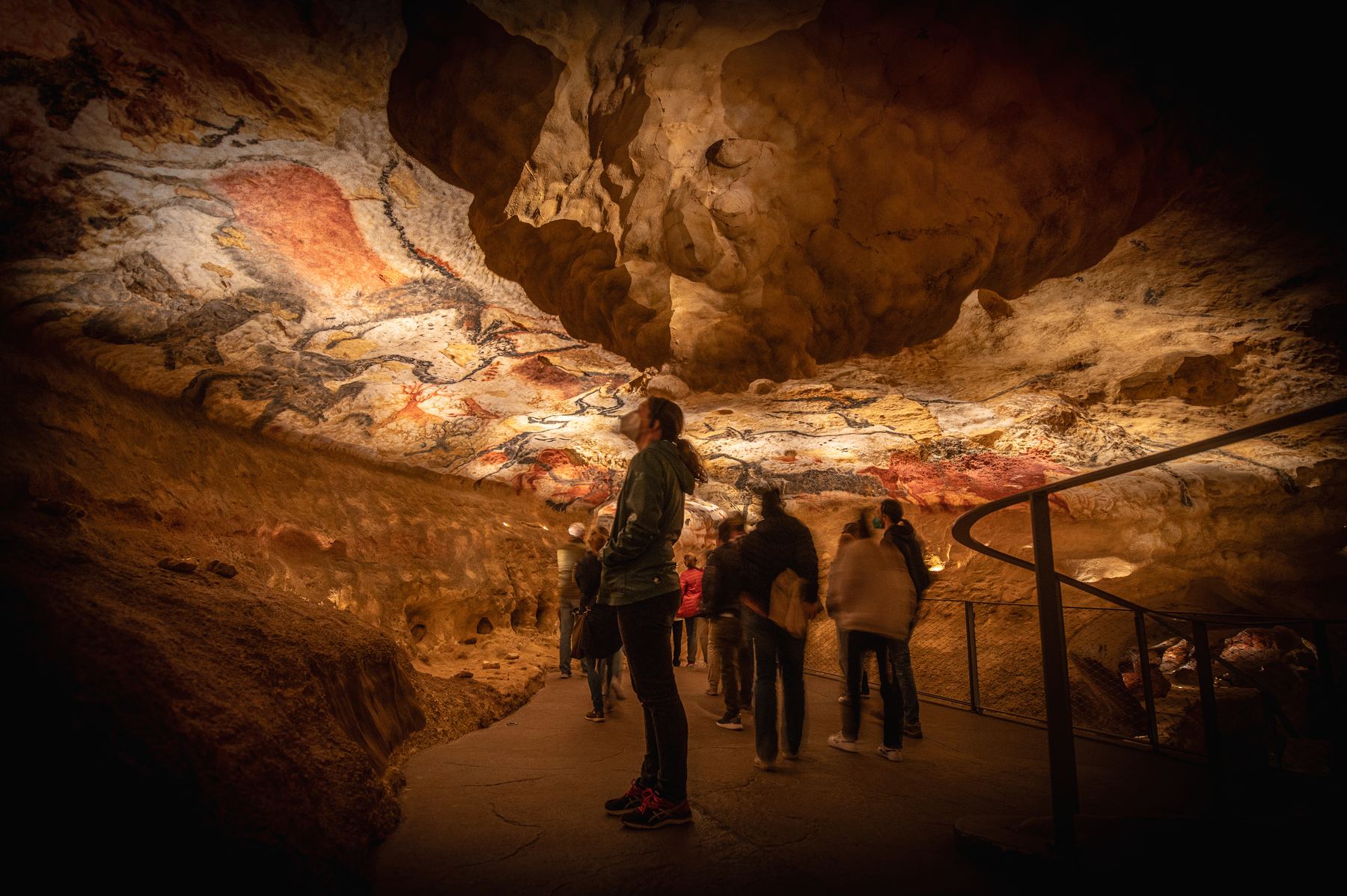 Visitors inside the full-scale replica of the cave